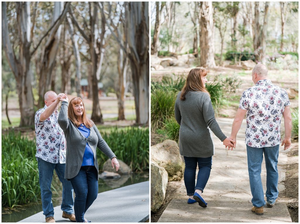 Couple dancing and holding hands in the park