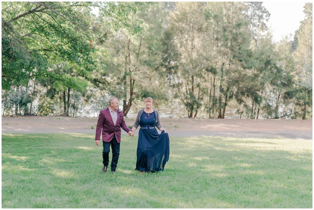 Bride and groom walking at their Wedding in the John Knight Memorial Park | Canberra wedding