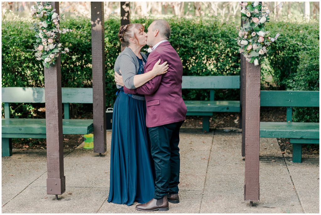 Bride and groom sharing their first kiss at their Canberra wedding