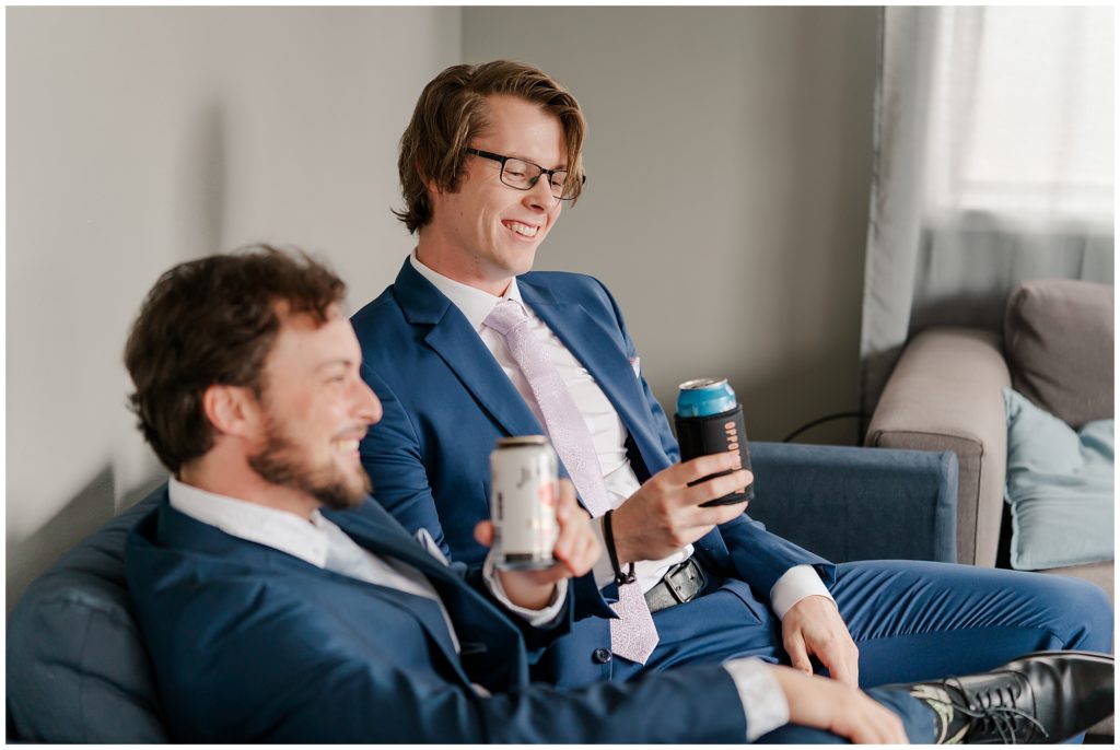 Groom and his best mate having a beer before the wedding