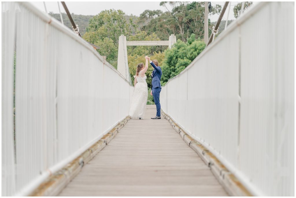Couple dancing on a white bridge in Canberra| Wedding photography