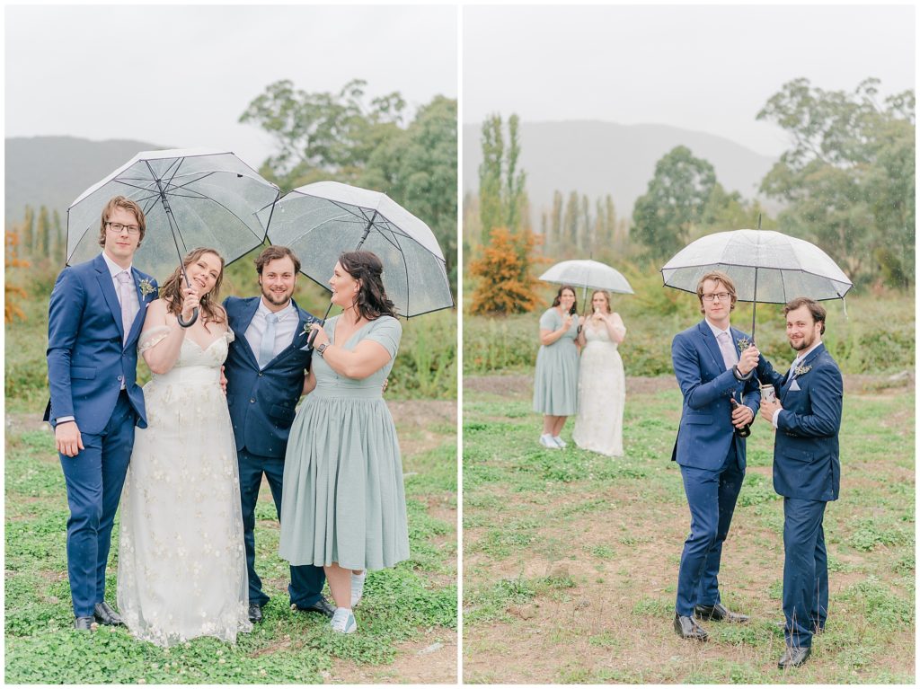 Bride and groom standing with the bridesmaids under an umbrella  on a rainy Canberra day
