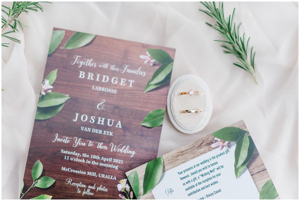 Wedding invitations wood and greenery