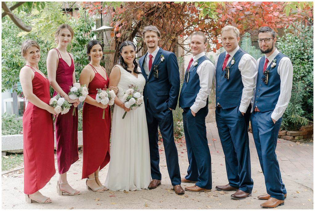 Red bridesmaids dresses with navy groomsmen suits | Destination Wedding photography